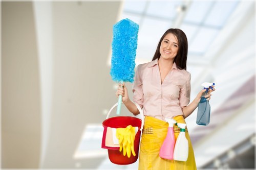 Cleaning reception, desks, and communal areas in an Acton office